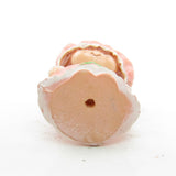 Bottom of Strawberry Shortcake in her nightgown figurine