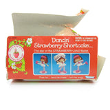 Top of Dancin' Strawberry Shortcake doll box with torn cardboard
