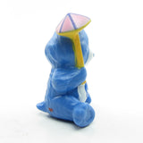 Grumpy Bear Care Bears figurine with pink and yellow umbrella or parasol