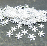Snowflake confetti in two different designs