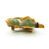 Hallmark pin with pixie boy sleeping on a leaf
