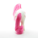 Birthflower pony with white body, pink hair, pink poppy flower symbol
