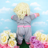 Cabbage Patch Kids girl doll with blonde hair, green eyes, tan skin