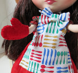 Blythe Apron with Red, Yellow, Green and blue knives, spoons, and forks