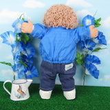 Cabbage Patch Kids boy doll with blue jacket, striped shirt, jeans, shoes