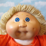 Cabbage Patch Kids girl doll with blonde hair and blue eyes
