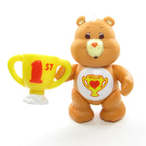 Champ Bear Care Bears poseable figure with Good Sport Trophy