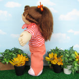 Cabbage Patch Kids Cornsilk doll with golden brown hair, blue eyes, tooth