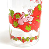 Custard cat and strawberries on vintage glass jar