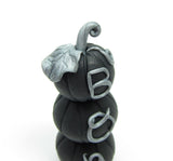 Black polymer clay pumpkins with "Boo" in silver writing