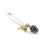 Miniature playscale doll necklace with silver pine cone charm