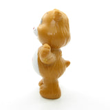 Tenderheart Bear listening to a friendly star miniature figurine