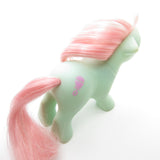 Baby Cuddles pony with pink rattle symbol