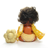Back of Orange Blossom Berry Baby doll with bottle