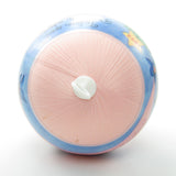 Pink silk ball ornament with discoloration at top