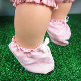 Pink baby doll booties with white bow