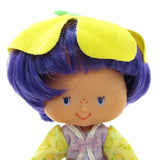 Almond Tea Strawberry Shortcake doll with purple hair and eyes
