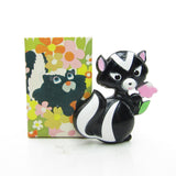 Vintage Avon Sniffy skunk Pin Pal with solid perfume