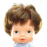 Baby Ann Fisher-Price doll with rooted brown hair, blue eyes
