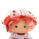 Cherry Cuddler Party Pleaser Strawberry Shortcake doll with pink hair, green eyes