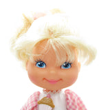 Cherry Merry Muffin doll with blonde hair, blue eyes