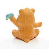Back of Friend Bear sitting with a flower miniature figurine