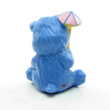 Grumpy Bear figurine with pink umbrella or parasol