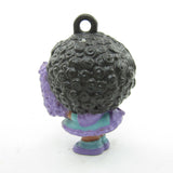 Back of Charmkins Hyacinthia Charmkins charm with purple dress and flower