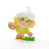 Lemon Meringue picking a flower miniature figurine