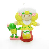 Lemon Meringue with Frappe Frog at sewing machine miniature figurine
