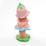 Back of vintage Avon Little Blossom miniature doll figurine with pink dress