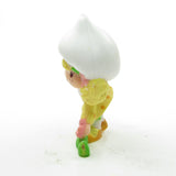 Side of Lemon Meringue picking a flower miniature figurine