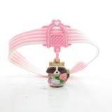 Charmkins Rosie Raccoon charm with pink and white striped garter belt