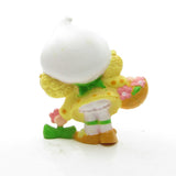 Back f Lemon Meringue picking a flower miniature figurine