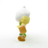 Side of Lemon Meringue picking a flower miniature figurine