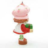 Strawberry Shortcake with a Christmas gift present ornament