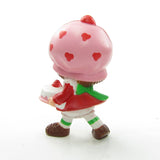 Strawberry Shortcake with a birthday cake miniature figurine