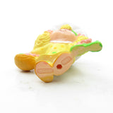 Bottom of Lemon Meringue picking a flower miniature figurine