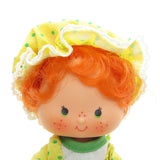 Apple Dumplin Party Pleaser doll with orange hair and green eyes