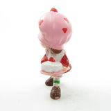 Strawberry Shortcake with a birthday cake miniature figurine