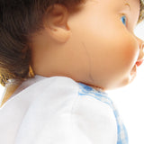 Baby Ann doll with pen mark on cheek