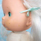 Strawberry Shortcake Apricot Baby Blow Kiss doll with highlighter marks on ears