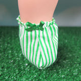 Green and white striped baby booties with green bow