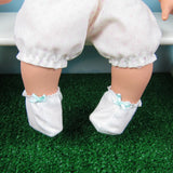 White baby doll booties with aqua bow