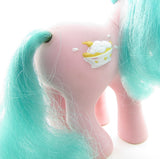 Banana Surprise pony with tail rust and scuff on symbol