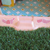 Peeling floor stickers on Strawberry Shortcake Berry Happy Home dollhouse