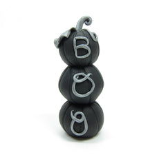 Black stack of pumpkins with "Boo" on front