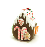 Miniature polymer clay gingerbread house with candy