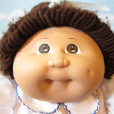 Cabbage Patch Kids girl doll with dark brown hair, brown eyes