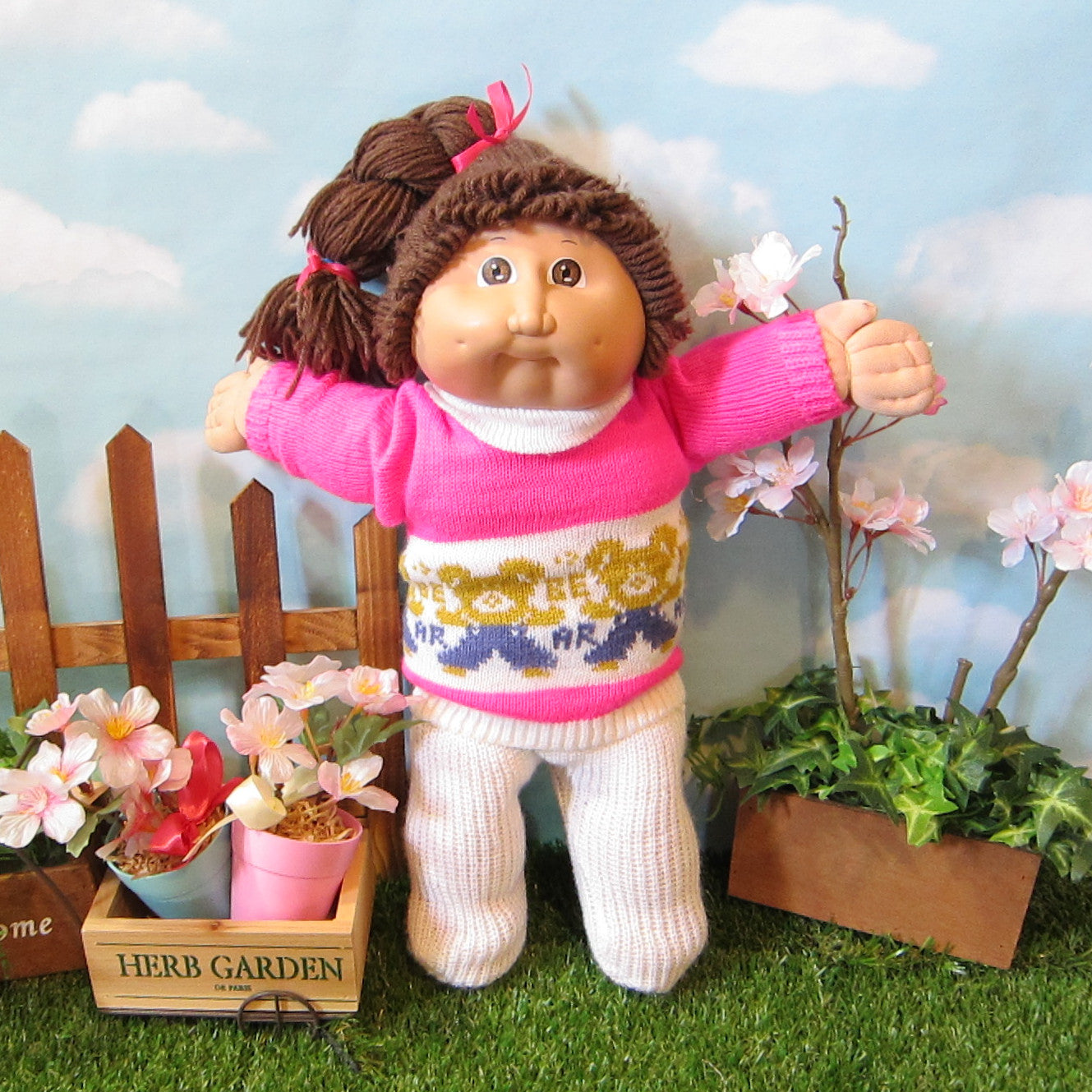 Cabbage Patch Kids girl doll with dark brown hair, brown eyes, dimples